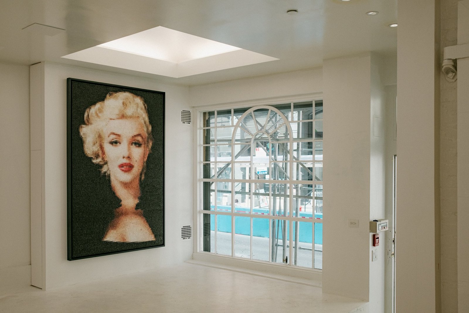 Transformed exhibition space at 19 Howard Street with a Marilyn Monroe artwork